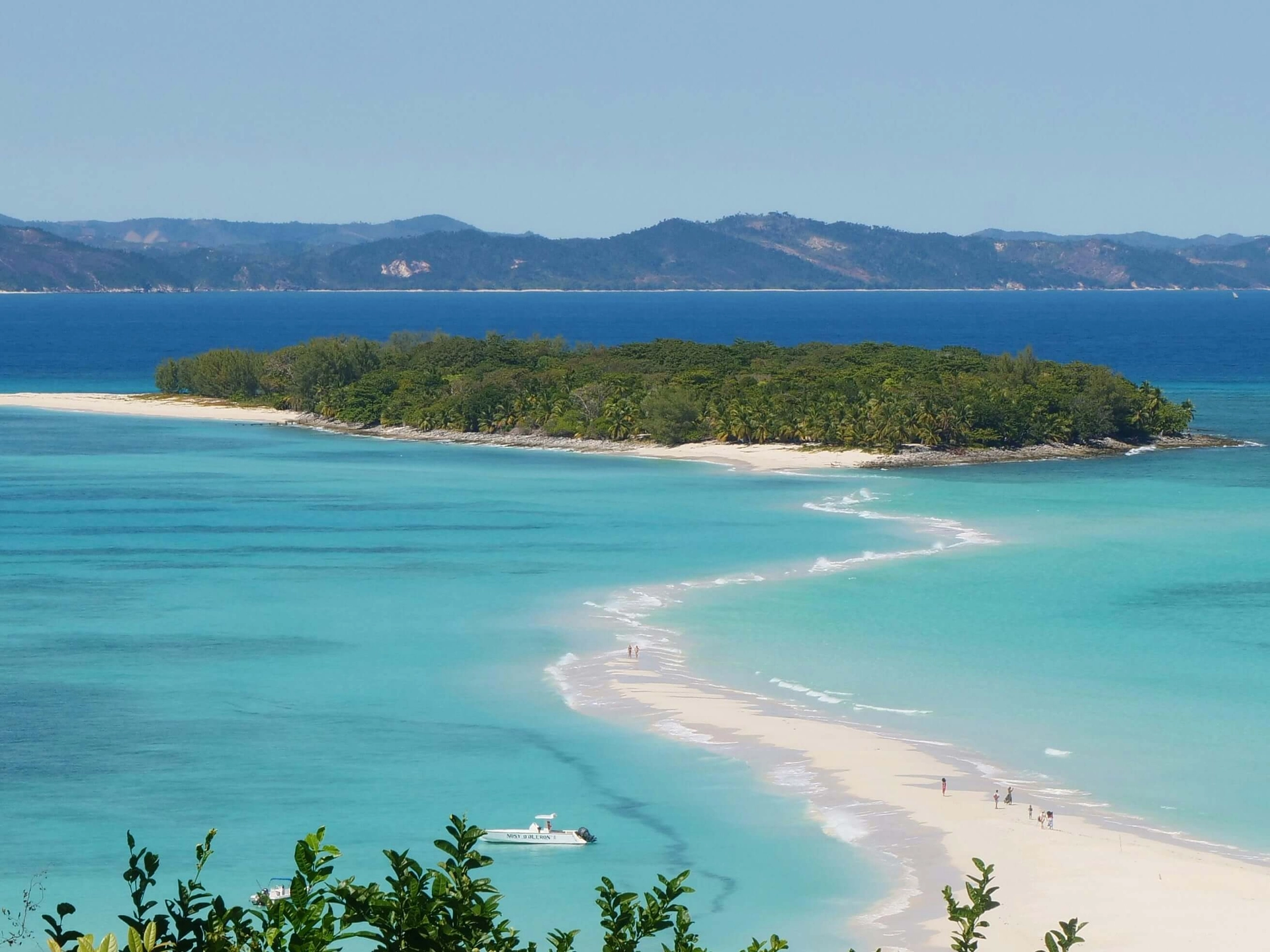 Pristine beaches of Madagascar with crystal clear waters and giant baobab trees